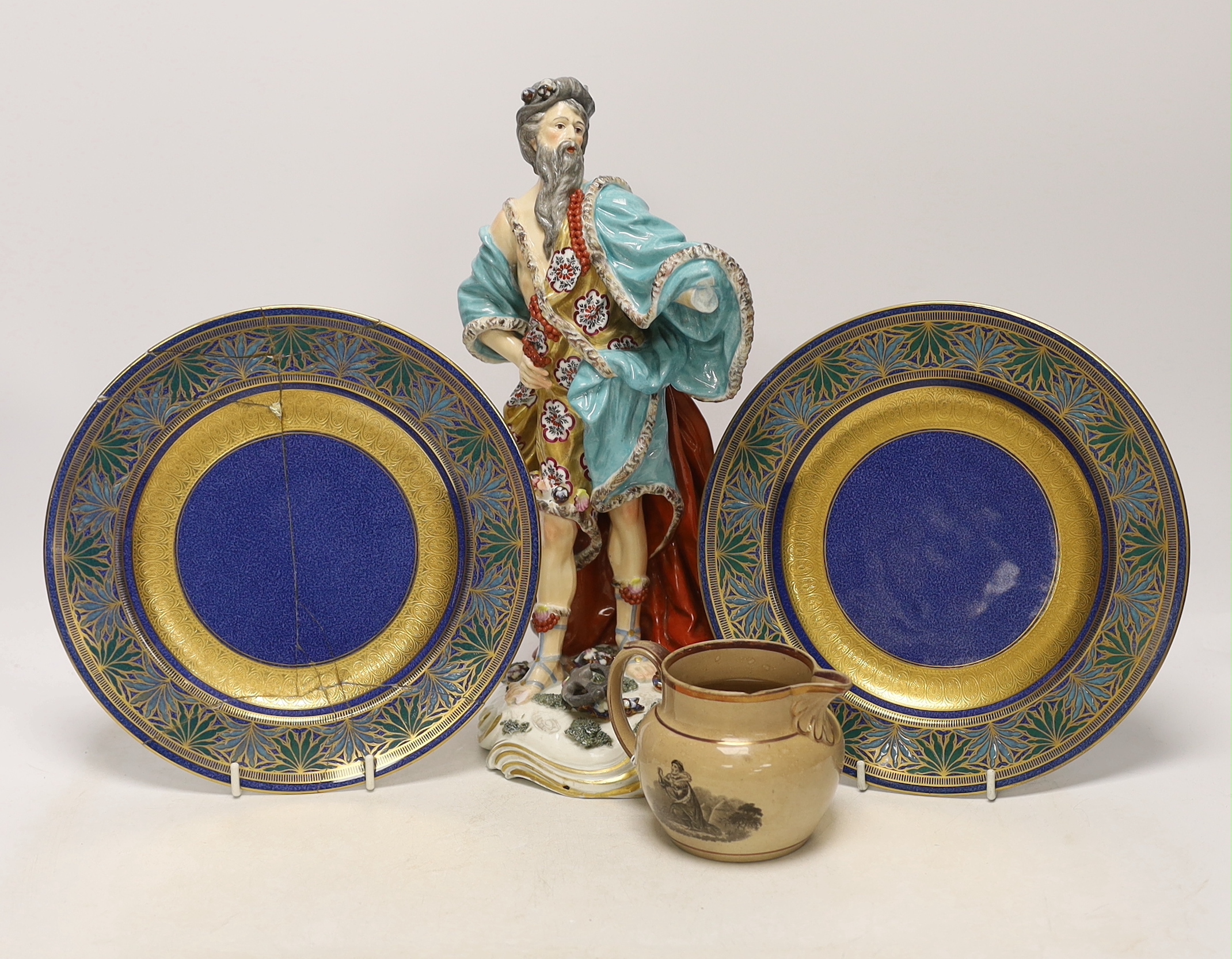 A Derby style figure of Neptune, two Wedgwood plates (one a.f.) and a Staffordshire drab ground jug, largest 32cm high